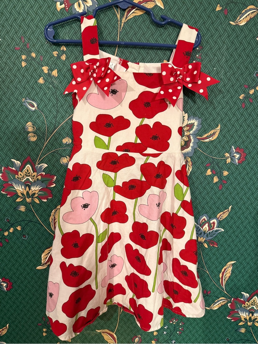 Floral toddler dress with bow accents and tie waist